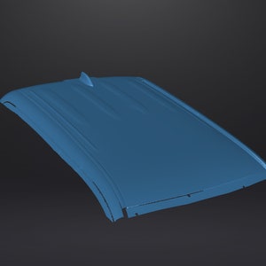May include: A blue car roof panel with a small fin on top.