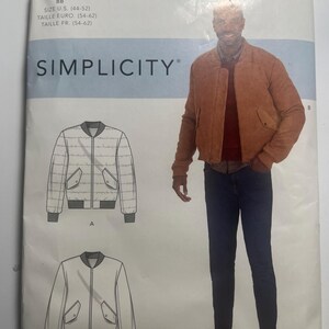 May include: Simplicity pattern R10899 for a bomber jacket. The pattern includes size information in U.S. sizes (44-52). The image shows a drawing of the jacket and a photo of a person wearing a similar jacket.