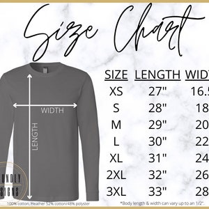 May include: Size chart for a long-sleeved shirt in grey. The chart shows the size, length, and width in inches for sizes XS to 3XL. The shirt is made of 100% cotton or a cotton and polyester blend.
