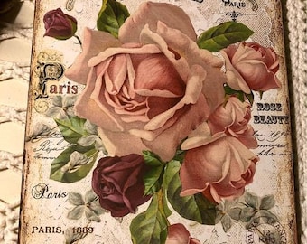 May include: Vintage floral print featuring a bouquet of pink and burgundy roses with green leaves. The print has the text "Belles Roses Paris" and "Rose Beauty" with a date and location.