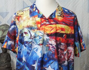 May include: A short-sleeved button-down shirt with a colorful print featuring a patriotic theme. The print includes images of the Statue of Liberty, American flags, and historical figures.