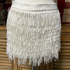 Express fringe skirt top