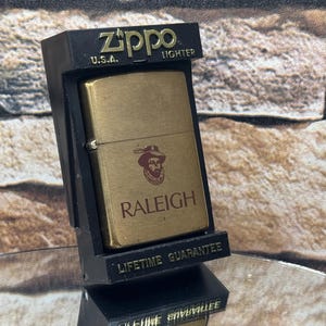1993 Vintage Raleigh Cigarettes Brass Zippo Lighter BRAND NEW