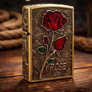 vintage-style lighter featuring a 3D embossed red rose design. image 1