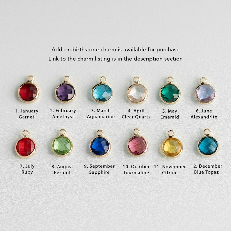 May include: Twelve birthstone charms in gold settings, each with a different coloured gemstone. The charms are arranged in two rows of six, with the month and gemstone name listed below each charm. The charms are available for purchase separately.