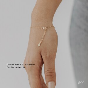 May include: A gold chain bracelet with a 2 inch extender. Comes with a 2" extender for the perfect fit.