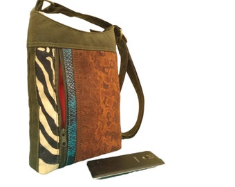 Waxed Cotton Cross Body/Shoulder Bag. Zip Closure Long Adjustable Strap. Feature zebra and snake skin fabric panels.