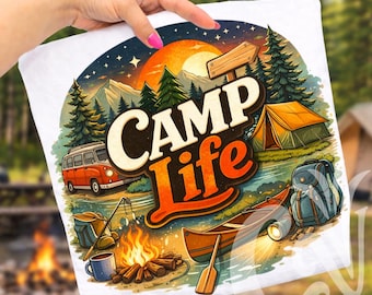 May include: White t-shirt featuring a colorful camping scene with the words "Camp Life". The design includes a campfire, tent, canoe, and a vintage orange van. The background shows mountains, trees, and a sunset.