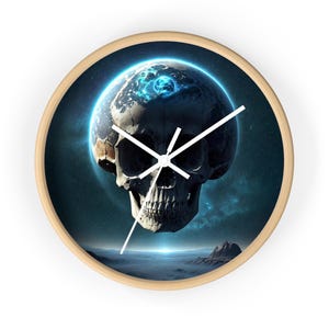 May include: A round wall clock with a light wood frame. The clock face features a surreal image of a skull with a planet in place of the brain, set against a starry background. White clock hands indicate the time.