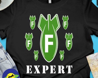 F-Bomb Expert funny graphic tshirt featuring a group of air bombs falling from the sky with a large letter "F" on them.
