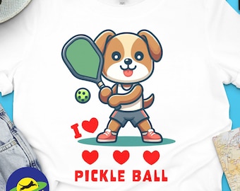 I Love Pickle Ball, Cute Dog playing Pickle Ball, funny graphic t-shirt for lovers of Pickle Ball and Dogs