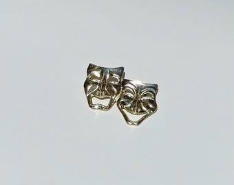 Broche vintage dorado con rostros de comedia y tragedia