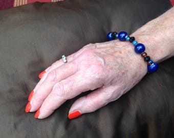 Handmade vintage style bead bracelet, blue and black with a hint of orange, ceramic and glass beads, toggle clasp