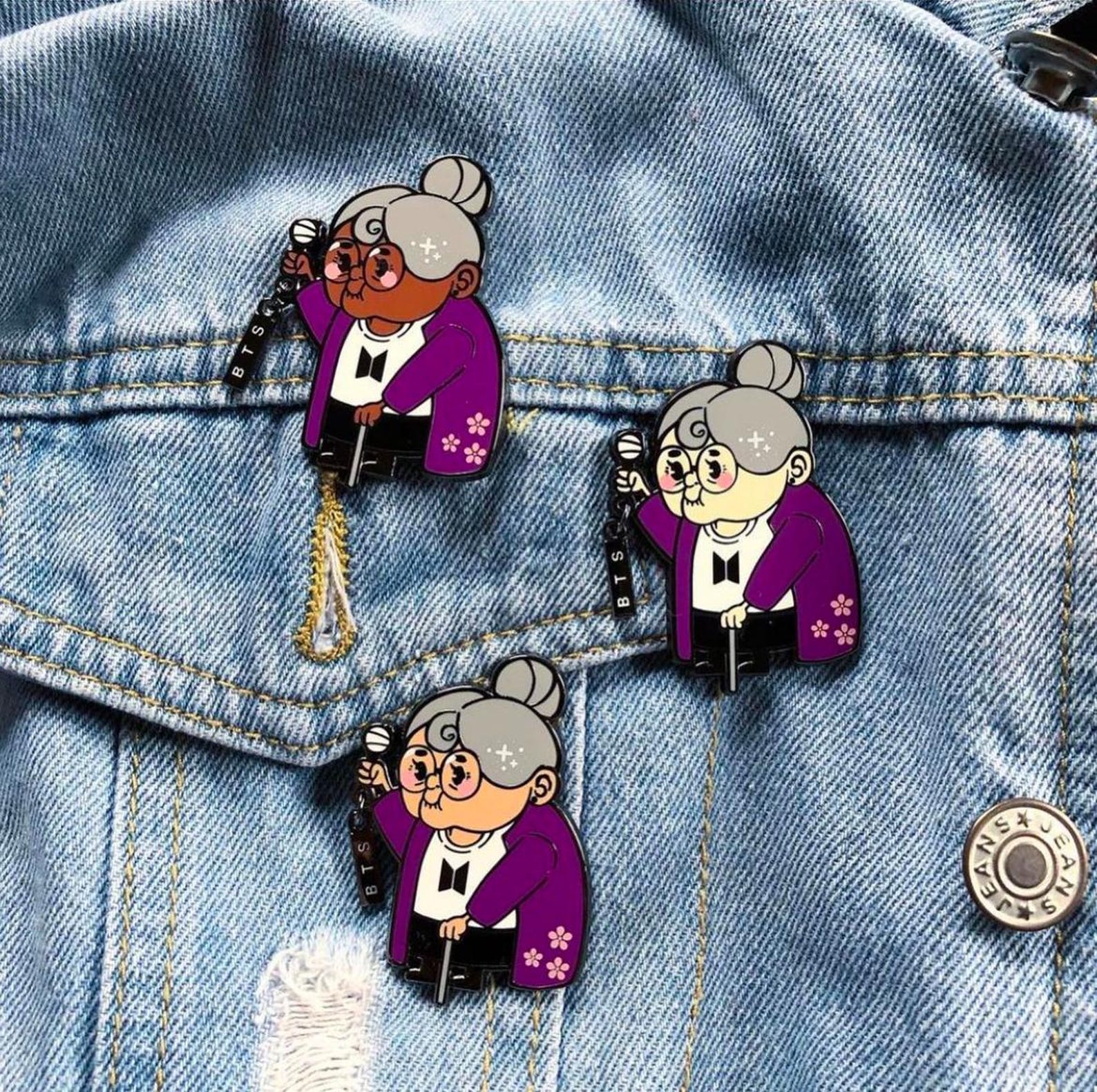Three grandma pins on a denim jacket