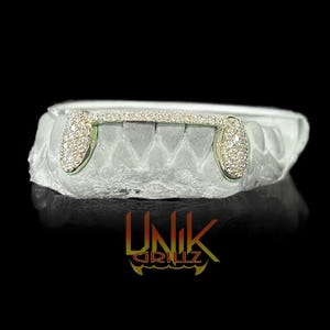 Custom Moissanite Grillz on fangs and front bar