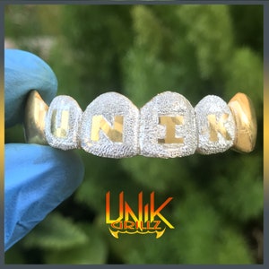 Custom Grillz with Diamond Dust and solid Name