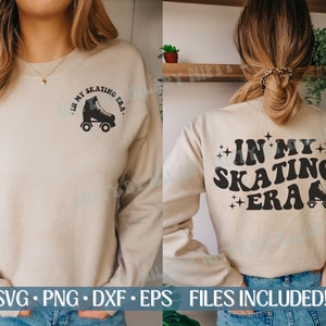 May include: A tan sweatshirt with the text "In My Skating Era" in black with a retro roller skate graphic. The sweatshirt is being modeled by a person wearing blue jeans.