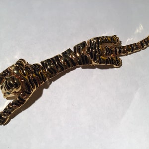 Vintage gold tone articulated tiger brooch