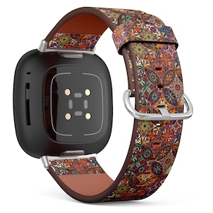 May include: A black smartwatch with a patterned leather band. The band features a colorful mosaic design with shades of red, orange, blue, and green. The watch has a silver buckle and a brown leather backing.