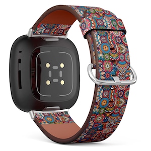 May include: A black smartwatch with a colorful patterned leather band. The band features a paisley design with red, blue, and green colors.