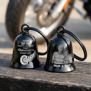 May include: Two black motorcycle bells with a loop handle. One bell has the text "THOSE We Love DON'T GO AWAY THEY Ride BESIDE US EVERY DAY" and a wing graphic. The other bell has a photo and the text "MOM & DAD".
