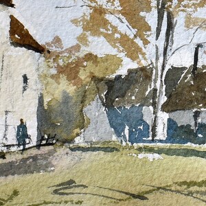 May include: Watercolor painting of a rural scene with buildings, trees, and a figure. The buildings have brown roofs and light-colored walls. The trees have brown and yellow leaves. A figure in a dark coat is walking on a path.