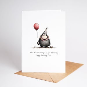 May include: A birthday card featuring a watercolor illustration of a gorilla holding a red balloon and wearing a party hat and a floral lei. The card has the text: "I saw this and thought of you...obviously Happy Birthday Bro!"