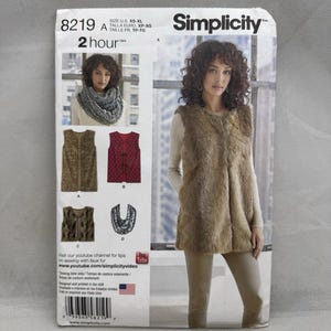 May include: A Simplicity 8219 sewing pattern envelope for a faux fur vest and infinity scarf. The front displays a model wearing a tan faux fur vest, with smaller images showing variations including a red patterned vest and a grey infinity scarf.