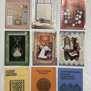 May include: A collection of nine instructional booklets for Hardanger embroidery, featuring various cover designs including floral patterns, holiday themes, and geometric motifs, with titles such as Hardanger Keepsakes II and Advanced Charted Hardanger Embroidery.