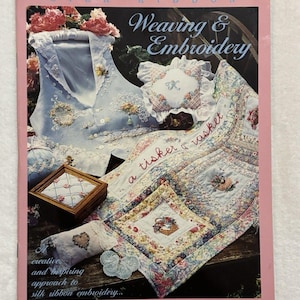 May include: A softcover book titled Silk Ribbon Weaving & Embroidery by Kari Mecca & Kathy Awender. The cover features a light blue vest, a small wooden box, a quilted fabric piece with floral patterns, and the text a tisket a tasket.