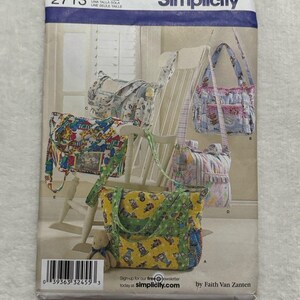 May include: A Simplicity sewing pattern envelope 2713 featuring illustrations of four different quilted tote bags with various colorful patterns, including yellow, blue, and pink designs. The envelope includes a barcode and the text Simplicity.