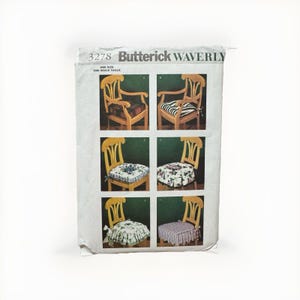 May include: A Butterick Waverly 3278 sewing pattern envelope featuring six illustrations of wooden chairs with various fabric seat cushions. The designs include plaid, striped, floral, and ruffled patterns for chair pads in one size.