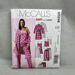 May include: McCall's M5248 sewing pattern envelope featuring Easy Endless Options. The front displays illustrations of a robe, camisole, and pants in plaid and floral patterns, with a model wearing a pink plaid robe, camisole, and pants set.