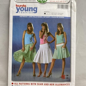 May include: A Burda Young Fashion sewing pattern packet featuring three models wearing hip skirts. The packet includes sizes 6/8 to 22/24 and European sizes 32/34 to 48/50. The text on the packet reads "All patterns with seam and hem allowances."