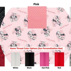 May include: A selection of fabric swatches in various colors, including black, pink, white, red, and grey. The swatches are arranged in a row with the color name printed below each one. The text "Name Thread Color Options (See Personalization Box)" is printed below the swatches.