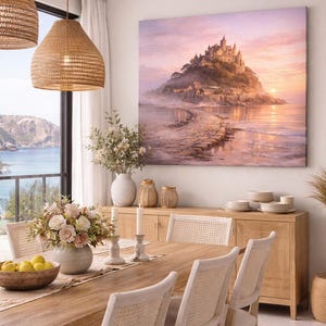 May include: A dining room scene featuring a large canvas print of a castle on a hill at sunset. The room includes a wooden dining table, chairs, and a buffet. Woven pendant lights hang above the table, and a large window offers a view of the ocean.