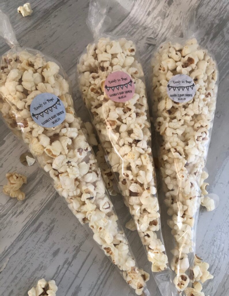 Ready to pop baby shower popcorn cones with personalised sticker and band to tie, choice of colours filled with delicious sweet popcorn 