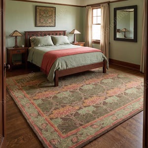 May include: A large rectangular area rug featuring a dark brown background with a repeating floral pattern in shades of sage green, muted orange, and cream. The rug has a wide decorative border with stylized leaf and flower motifs in matching colors.