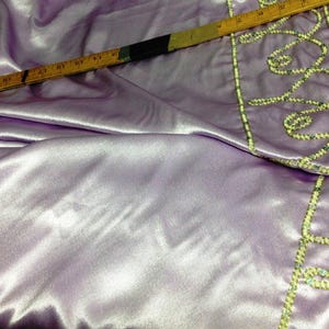 60&quot; Wide Pale Lilac CrepeBacked Satin With Sequinned Lace Border Designer Fabric
