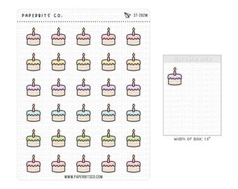 May include: A sticker sheet from Paperbits Co. featuring thirty small birthday cake illustrations in various pastel colors, each with a single lit candle. A size reference box indicates a width of 1.5 inches for each individual sticker.