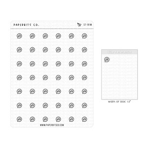 May include: A sheet of 1.5 inch wide music note stickers. The sheet is white with a grid of 6 rows and 6 columns of black music note stickers. The sheet has the text "PAPERBITS CO." and "WWW.PAPERBITSCO.COM" printed on it. The sheet also has a small paper airplane icon in the top right corner.