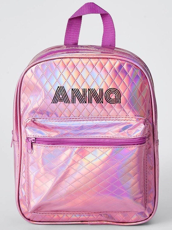 pink holographic backpack
