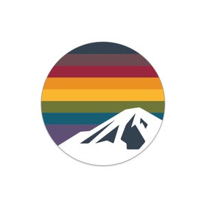 May include: A circular sticker featuring a mountain silhouette in white against a backdrop of horizontal stripes in a gradient of colors, including red, orange, yellow, green, and blue.