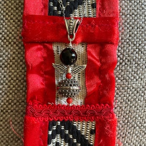 Angel Pendant with “Su Coccu” and Sardinian Button on a Necklace