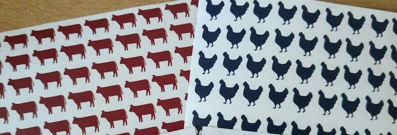 May include: Two sheets of wrapping paper with repeating patterns. One sheet features a red cow silhouette on a white background. The other sheet features a black chicken silhouette on a white background.