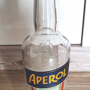 Bottle glass bottle transparent empty with label "Aperol" - Upcycling, Recycling