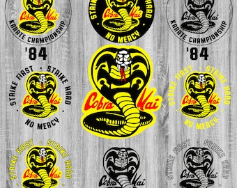 May include: Six black and yellow Cobra Kai karate logos with the text "Strike First, Strike Hard, No Mercy". The logos are on a wood grain background.