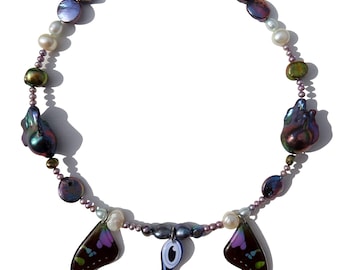 purple spotted swallowtail butterfly wings, freshwater pearls, evil eye inspired charm necklace