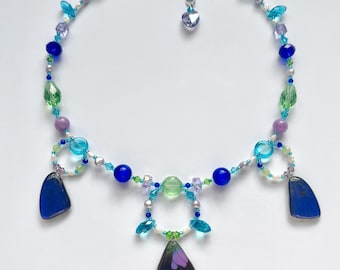 butterfly wing charm necklace with freshwater pearls, jade beads, and stainless steel