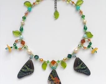 sunset moth wing charm necklace with freshwater pearls, opalite, agate, jade, and glass beads